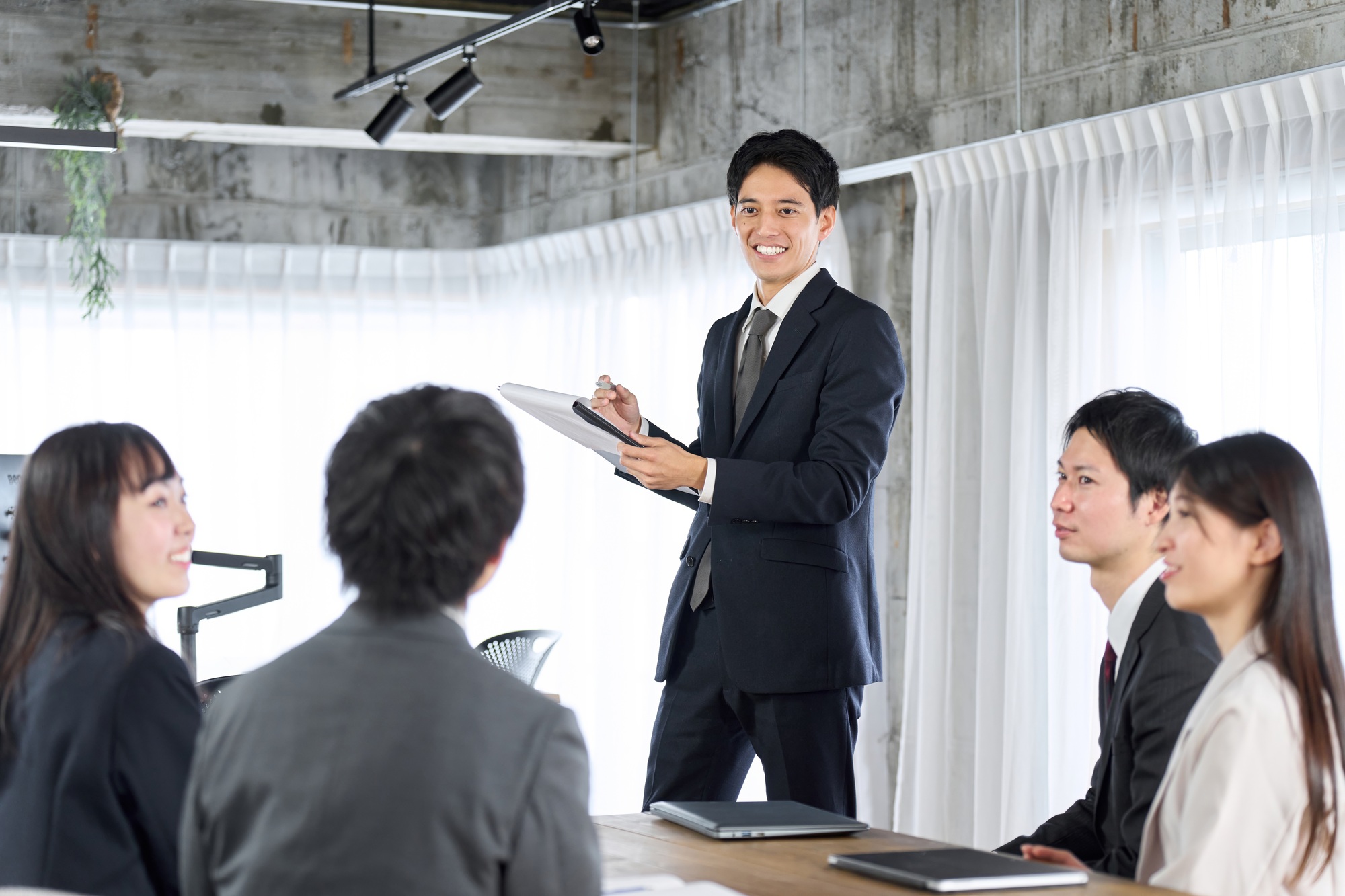 Businessman training new employees in the office