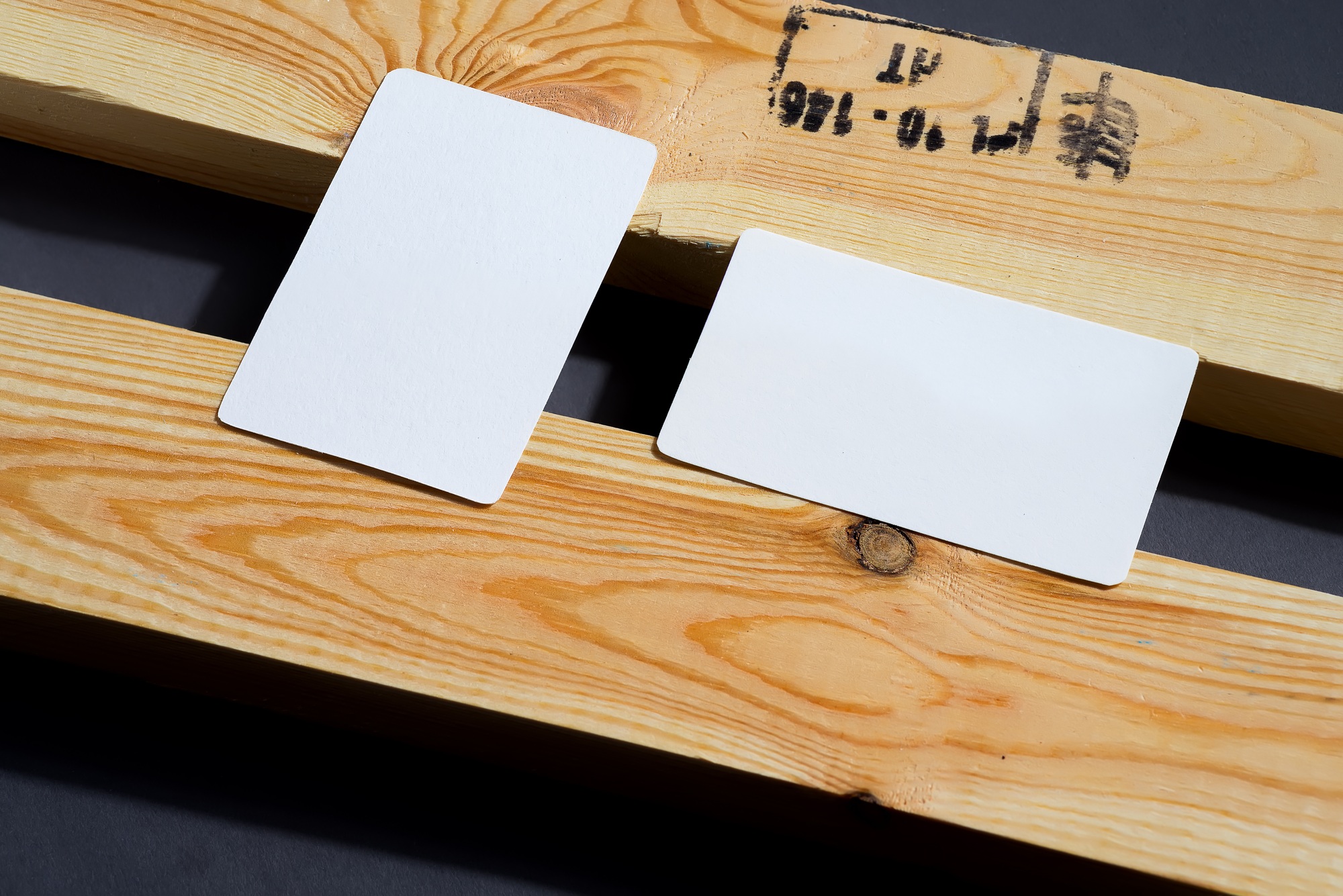 blank business cards on black and wooden background, good for texte and logo