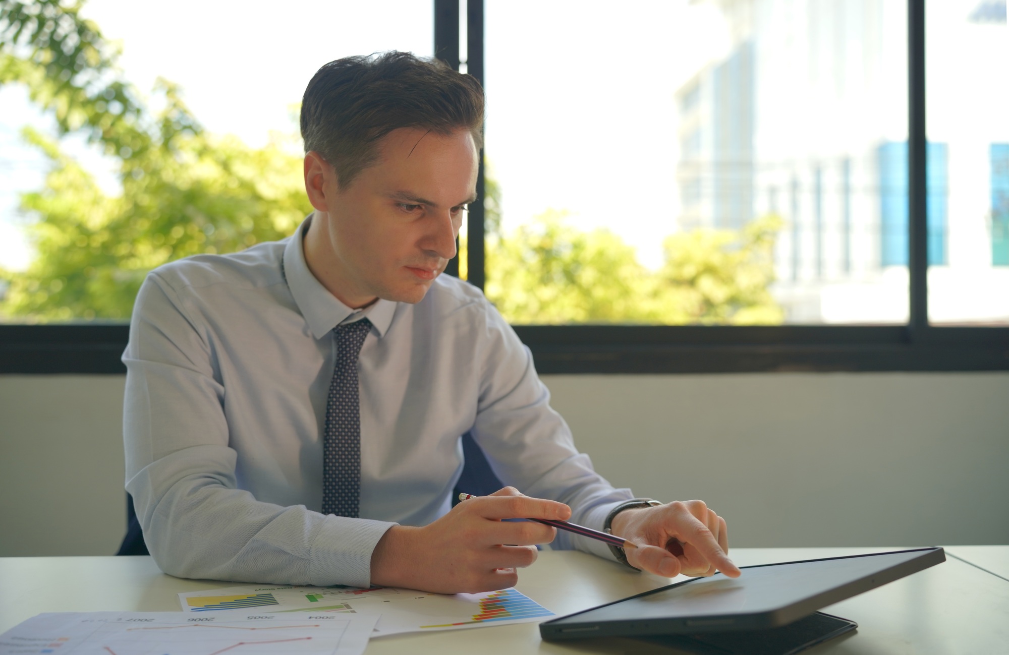 Businessman scheduling meeting in office