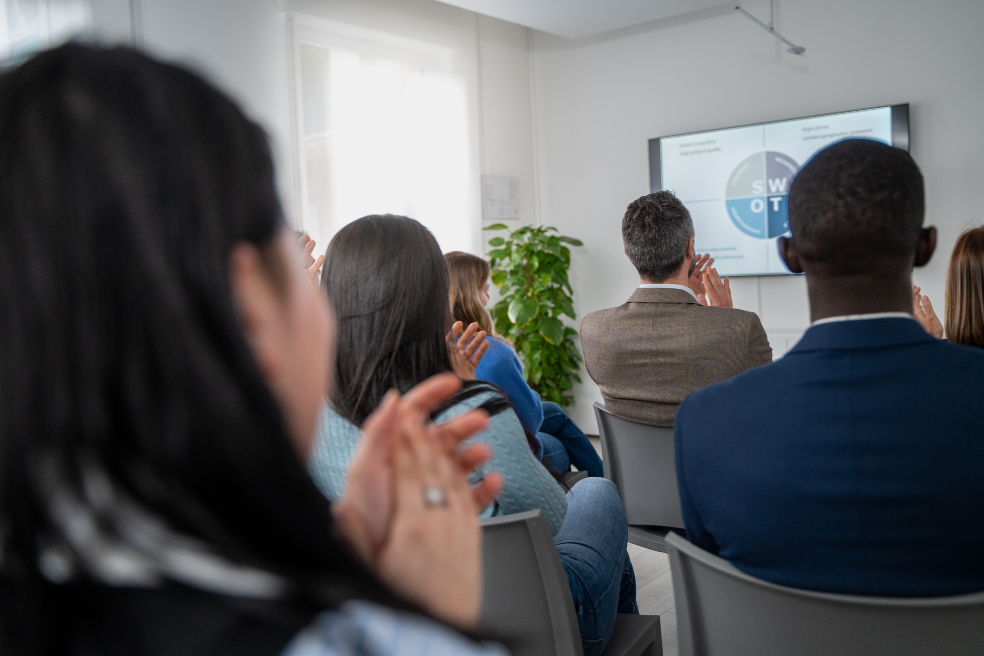 Diverse business team meeting presentation conference room professional development training seminar