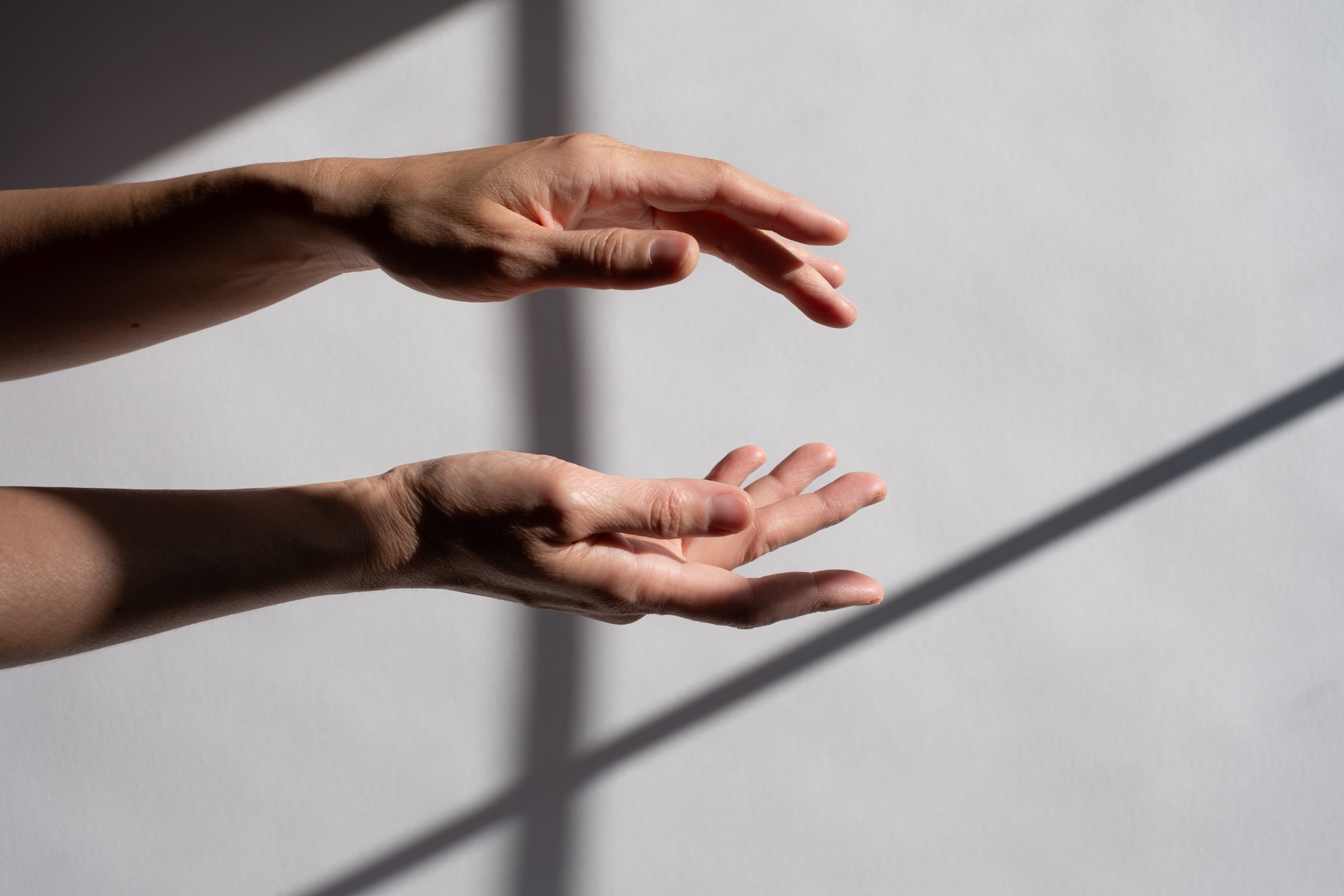 Two hands position with space for commercial product.