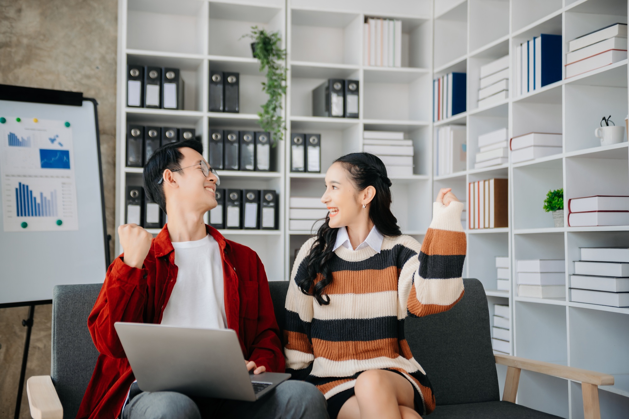 Young Asian business team creative businesspeople coworker, teamwork celebrating achievement and