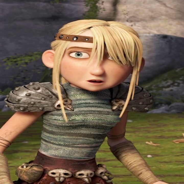 The animated character, Astrid, with braided hair, wearing armor with skull motifs, looking surprised in a forest setting