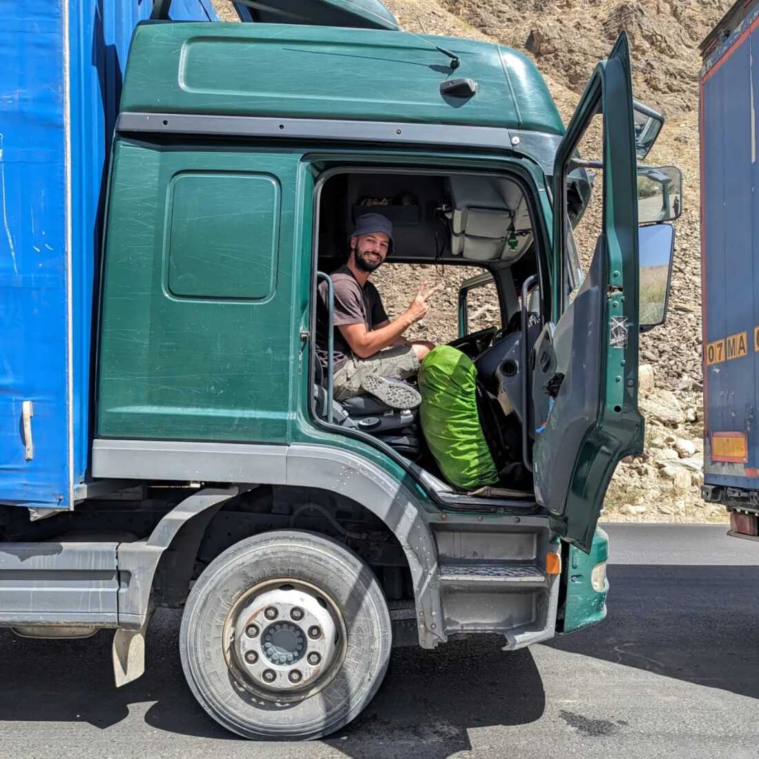 Nok hitchhiked across the mountains of Tajikistan in early September. A truck driver who picked him up and drove him about 14 hours took this photo of Nok during a break on the Pamir Highway.