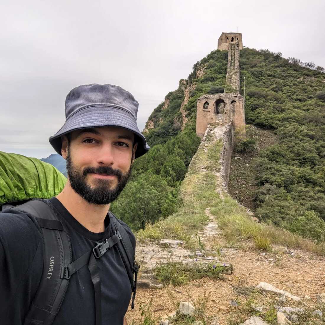 On a visit to the Great Wall of China, Nok spent the night in a watchtower, seen in the background, located in an unrestored section of the historic landmark.