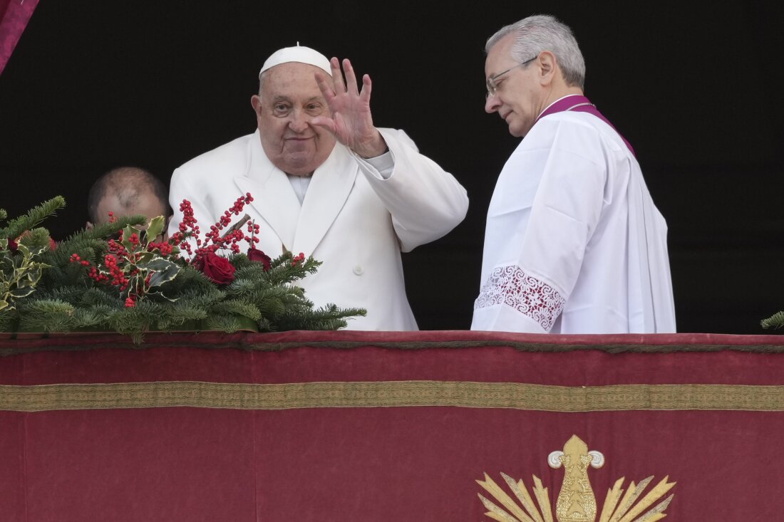 Pope Francis waves before delivering the Urbi et Orbi (Latin for 'to the city and to the world' ) Christmas' day blessing from the main balcony of St. Peter's Basilica at the Vatican, Wednesday, Dec. 25, 2024.