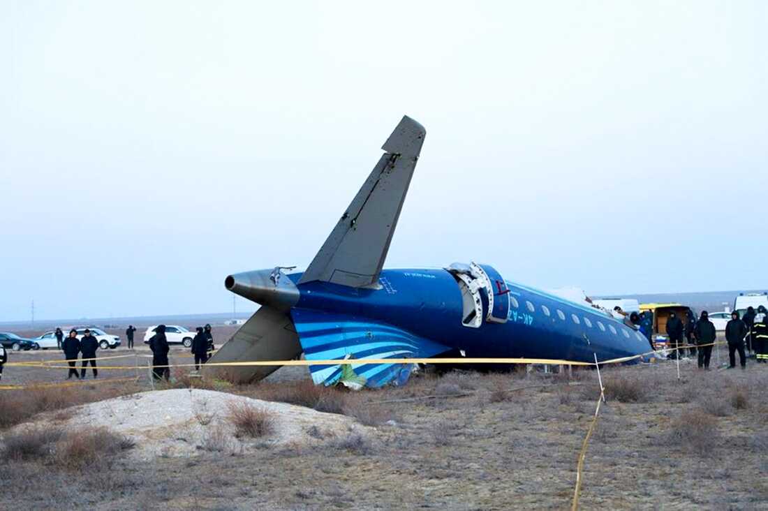 In this photo taken from a video released by the administration of Mangystau region, a part of Azerbaijan Airlines' Embraer 190 lies on the ground near the airport of Aktau, Kazakhstan, on Thursday.