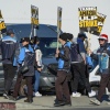 Amazon workers strike outside the gates of an Amazon fulfillment center in City of Industry, Calif., on Thursday.