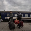 Evacuees from the city of Pokrovsk arrive at the train station in Pavlohrad, Ukraine, on Oct. 15. They are fleeing to cities in western Ukraine or other points in Europe. Pokrovsk, a coal mining center in eastern Ukraine, is under frequent Russian artillery barrages and aerial attacks.