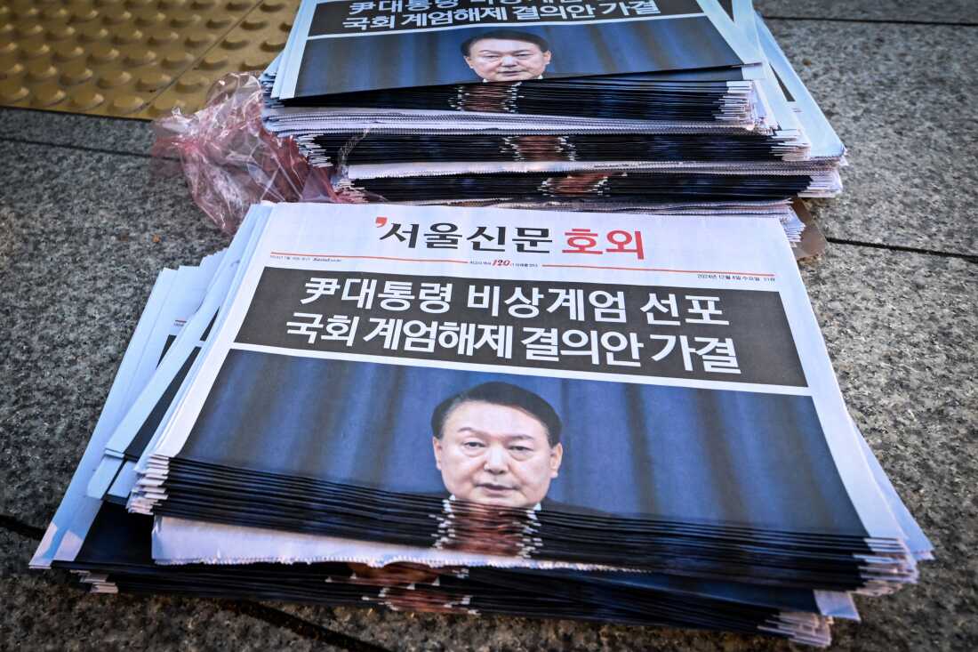 Extra edition newspapers are displayed at a subway gate in downtown Seoul on December 4, 2024, after martial law was lifted.