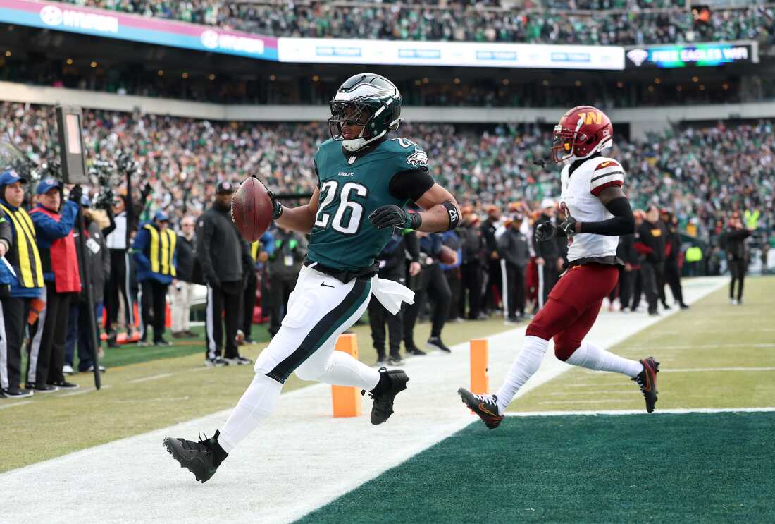 Saquon Barkley #26 of the Philadelphia Eagles scores a 4 yard touchdown against the Washington Commanders during the first quarter in the NFC Championship Game at Lincoln Financial Field on Jan. 25 in Philadelphia, Pennsylvania.