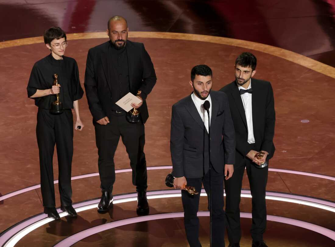 Rachel Szor, left, Hamdan Ballal Basel Adra and Yuval Abraham accept the Oscar for best documentary feature film for No Other Land.