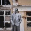 A damaged statue of Soviet Union founder Vladimir Lenin in a central square in Sudzha, in the Kursk region of western Russia, on Aug. 16. Ukrainian troops say they've taken control of Sudzha, one of more than 80 towns and villages they've captured since a cross-border invasion of Russia on Aug. 6.