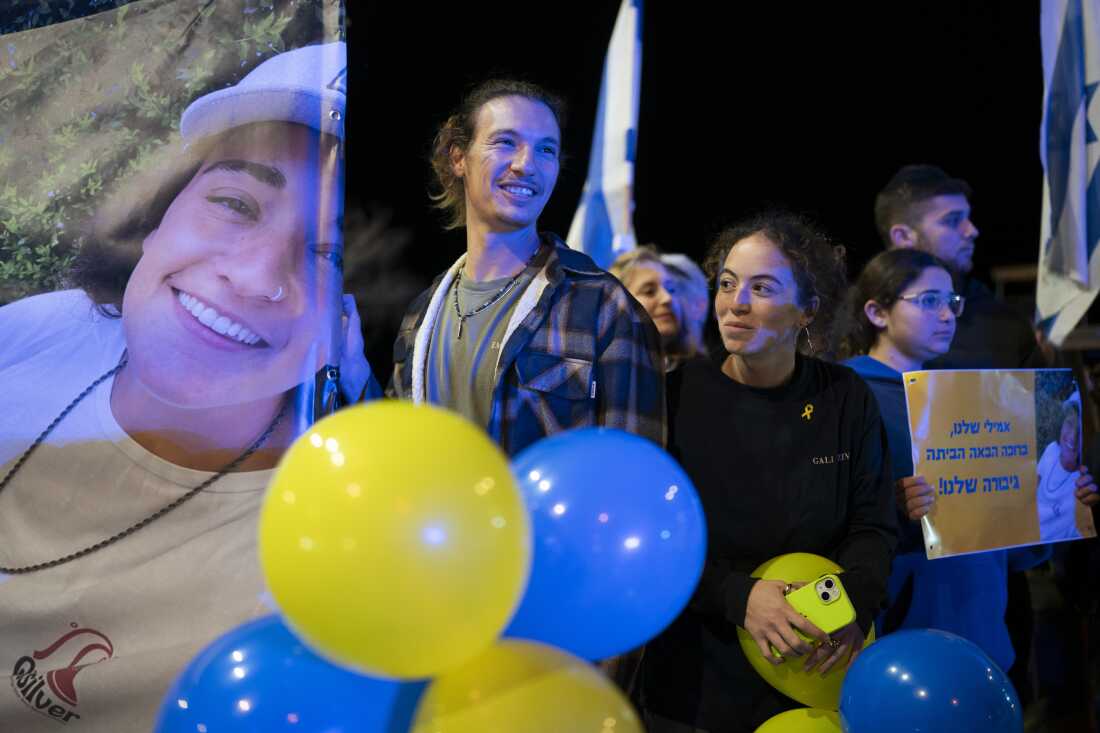 Friends of Emily Damari, hold a sign with her image that reads ‘Our Emily, Welcome home, Our hero’. Emily was held in Gaza since the deadly Oct.7 2023 attack, released as part of a ceasefire deal in Gaza between Hamas and Israel, by Israel’s border with Gaza in southern Israel, Jan. 19, 2025.