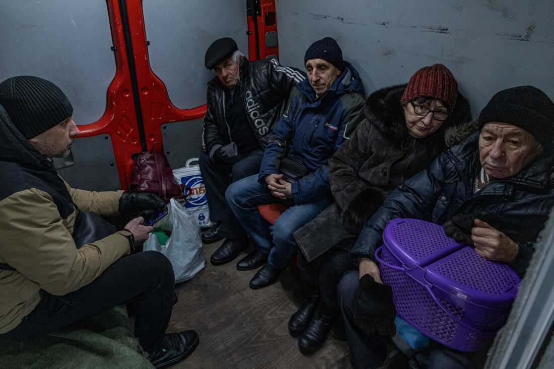 Residents of Pokrovsk inside the armored evacuation minivan before evacuation from town.
