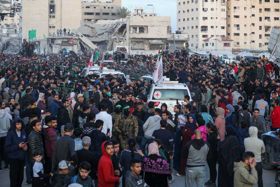 Al-Qassam Brigades hand over 3 female Israeli hostages to Red Cross at al-Saraya as part of 1st phase of ceasefire and prisoner swap deal between Israel and Hamas, in Gaza City, Gaza on January 19, 2025.