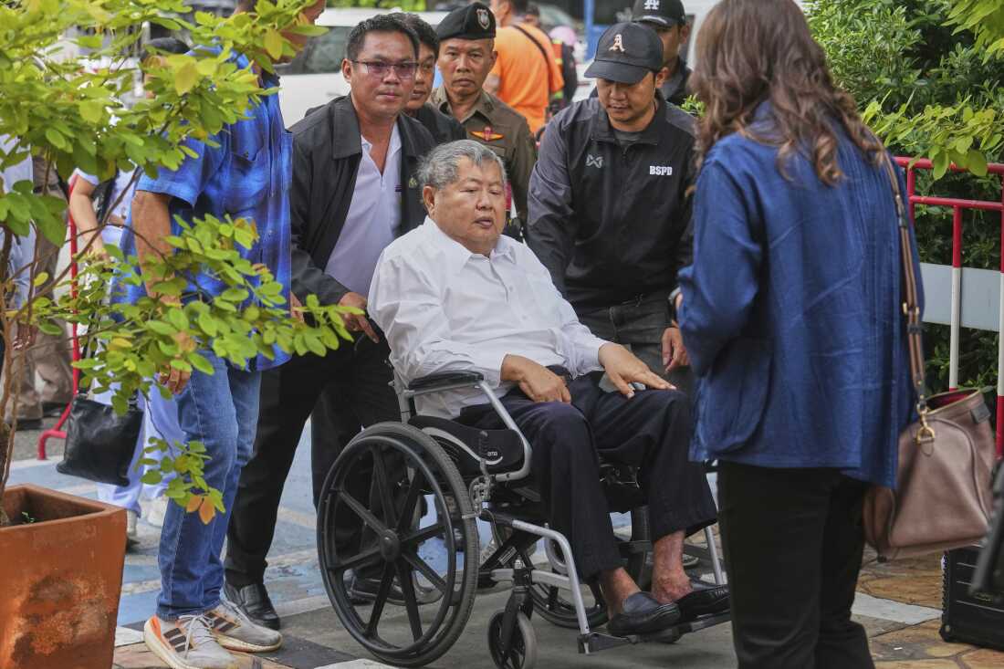 Premchai Karnasuta, the president of Italian-Thai Development Co arrives on a wheelchair at Bang Sue Police Station in Bangkok, Thailand on Friday to surrender to police on criminal negligence charges for the collapse of a Bangkok high-rise during a March 28 earthquake.