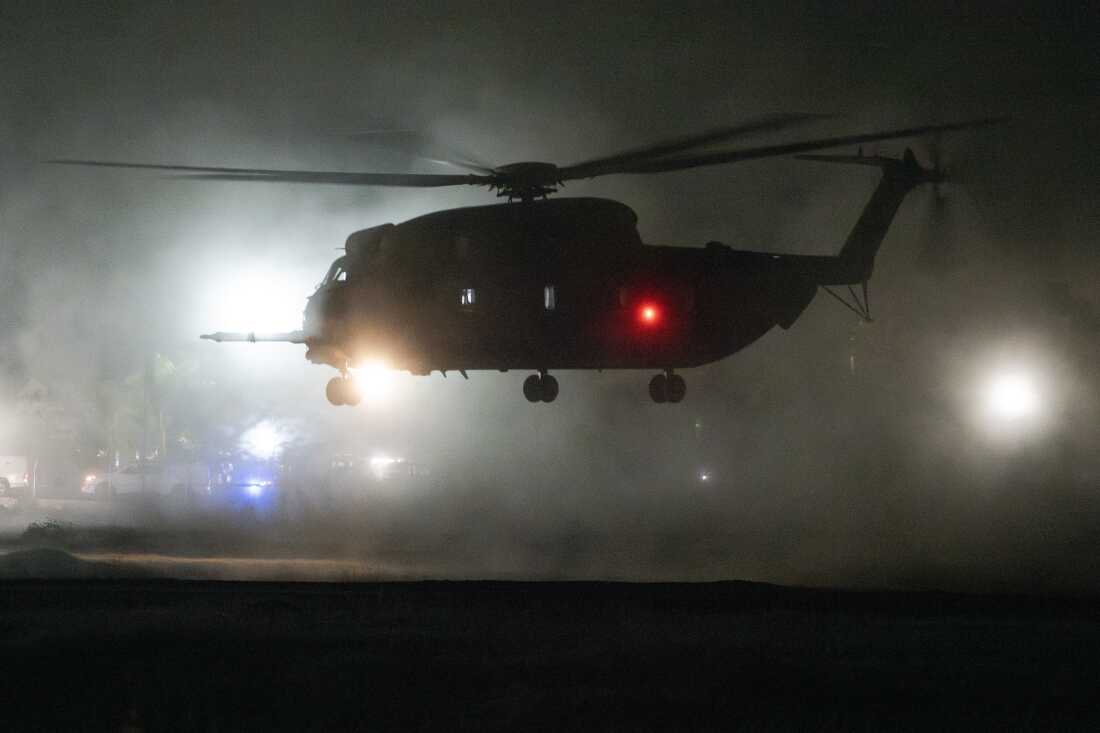 People look towards the Gaza Strip, amid a ceasefire between Israel and Hamas, near the Israel-Gaza border, in Israel, January 19, 2025