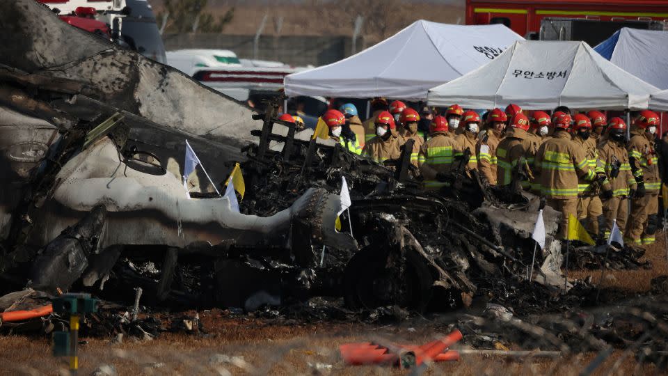 Rescue workers take part in a salvage operation at the site where an aircraft crashed after it went off the runway at Muan International Airport, in Muan, South Korea, on December 29, 2024. - Kim Hong-Ji/Reuters