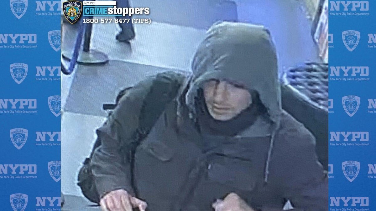 A screenshot from surveillance footage released by the NYPD shows an alleged person of interest wanted in connection for the shooting death of UnitedHealthcare CEO Brian Thompson