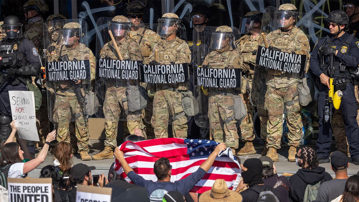 Protesters confront the California National Guard