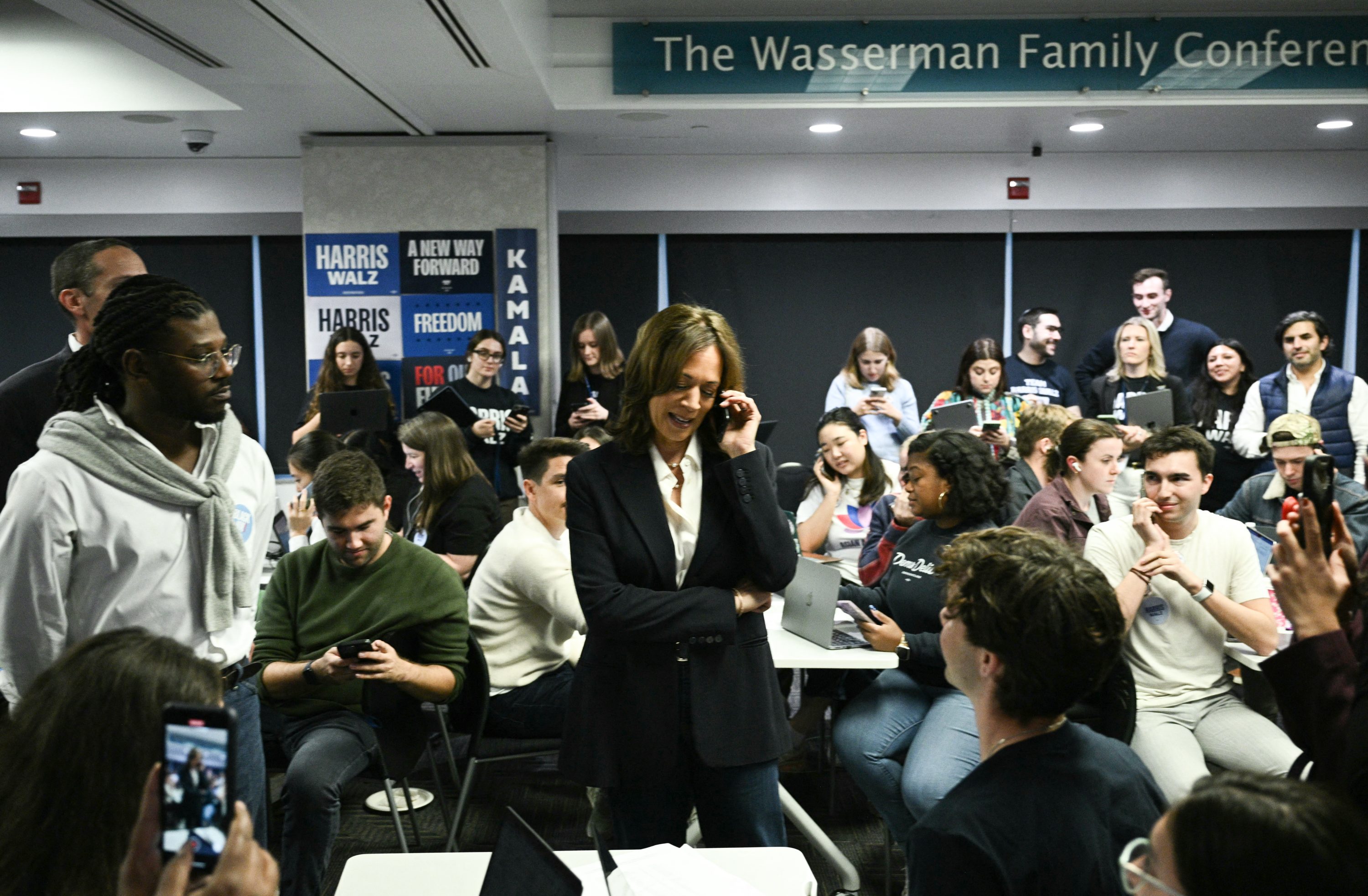 Democratic presidential candidate Kamala Harris takes part in a phone bank at the Democratic National Committee headquarters in Washington, DC, on November 5, 2024