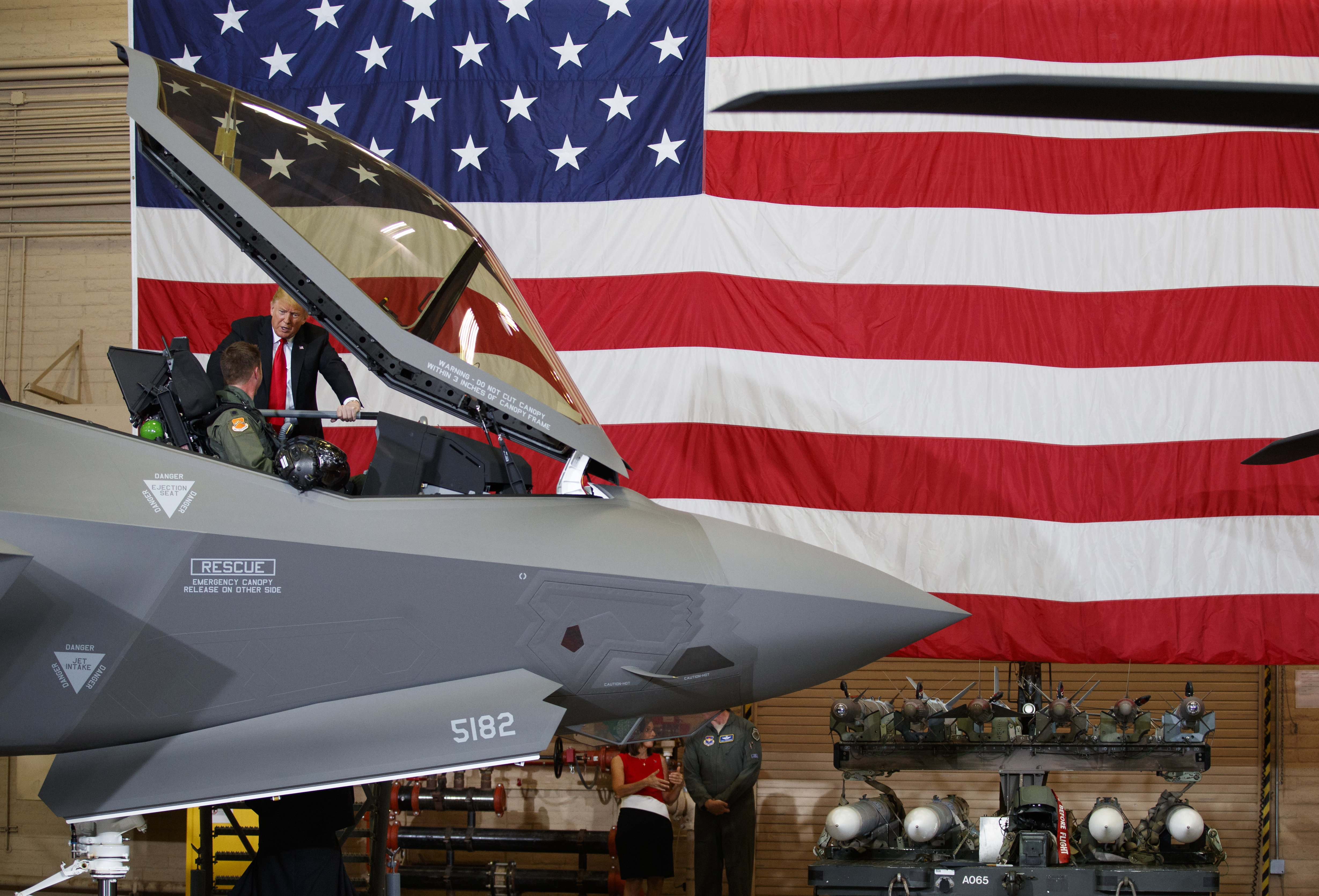 President Donald Trump talks to a pilot in the cockpit of an F-35 aircraft during a Defense Capability Tour at Luke Air Force Base, Ariz., Friday, Oct. 19, 2018. (AP Photo/Carolyn Kaster)