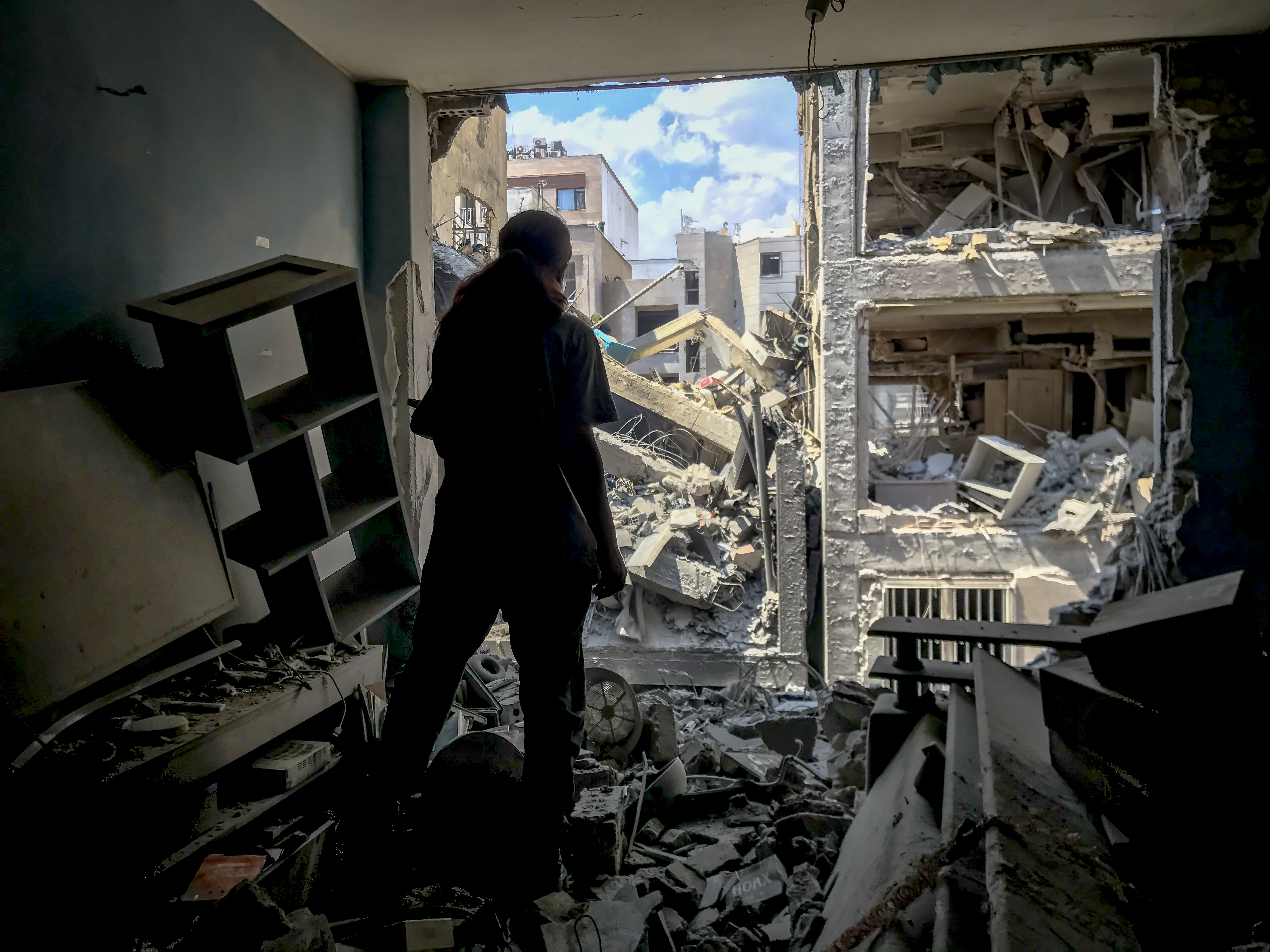Photo from inside a house across a targeted residential building shows extensive damage in Tehran, Iran, on June 13, 2025. (Photo by Saba / Middle East Images via AFP) (Photo by SABA/Middle East Images/AFP via Getty Images)